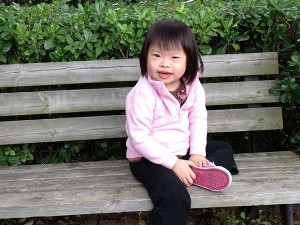 Olivia on a park bench