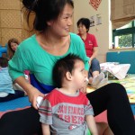 Holly Chen with a child at Shanghai Healing Home