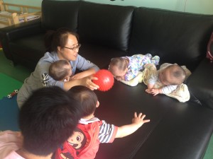A therapist from the center works with infants