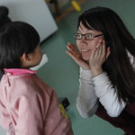 Frangie Yan, a member of our administrative team, works with a child in Inner Mongolia