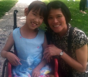 Eva Ma, Occupational Therapist, celebrates Children's Day with Charissa, a former client