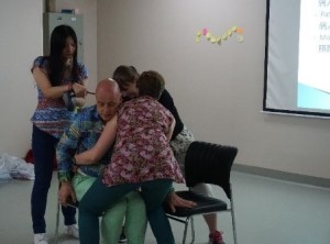 Demonstration of transporting a patient by presenting a detailed breakdown of each caregiver’s role in this task.
